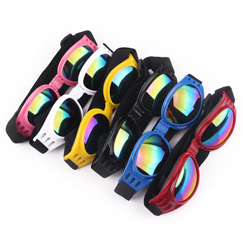 Seis óculos de sol protetores de UV para cães em plástico, cores rosa, branco, amarelo, preto, azul e vermelho, com lentes iridescentes.